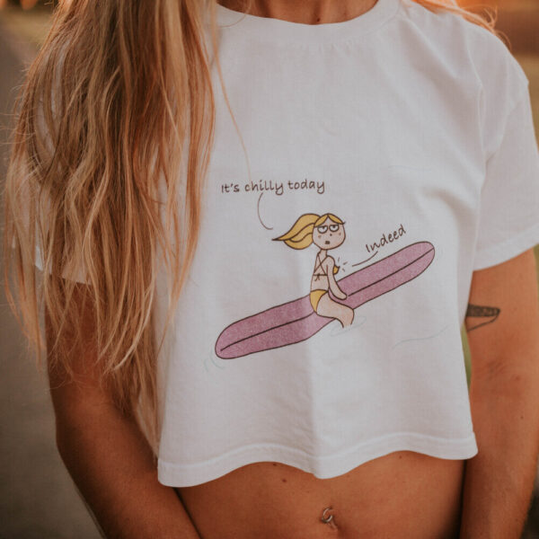 woman wearing a crop top with a funny surf girl illustration